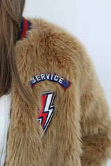 The letterman patch fur jacket